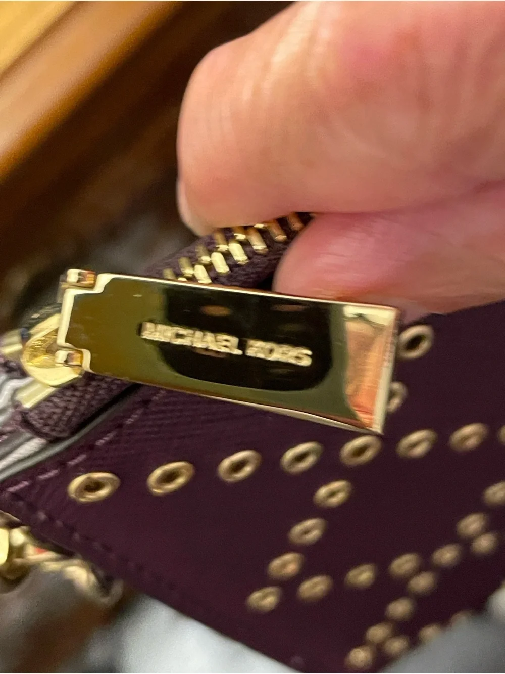 MICHAEL KORS  Brooklyn Plum Wristlet with Gold Eyelet Detail
